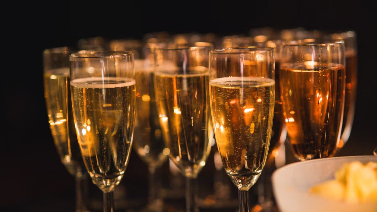 A group of champagne glasses with sparkling bubbles, perfect for a celebration.